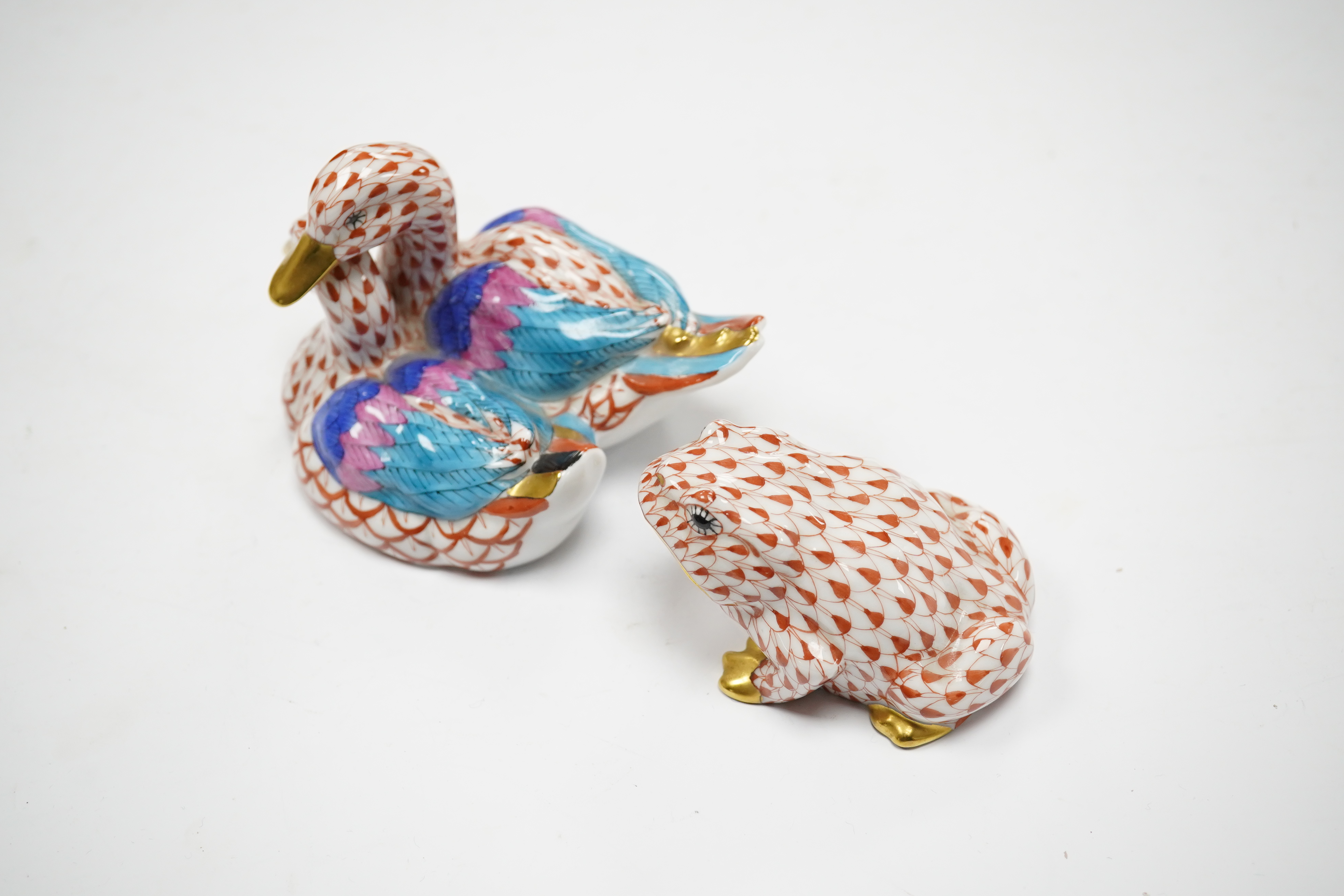 Two porcelain Herend red scale animal figures comprising a duck group and a toad, largest 11cm wide. Condition - good